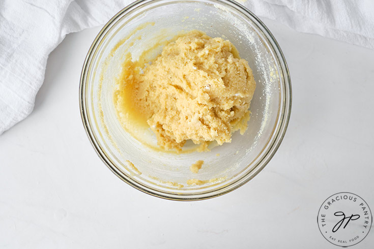 The mixed cookie dough in its mixing bowl.