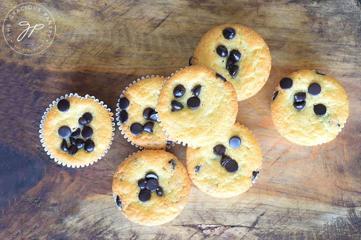 The finished almond flour muffins on a wooden surface.