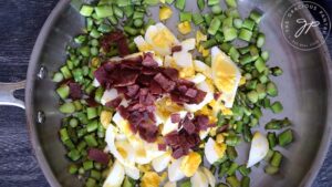 Adding in the bacon bits to this Asparagus Salad Recipe