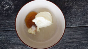 The dressing ingredients in a small mixing bowl, waiting to be whisked together.