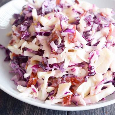 A front view of this Cabbage Salad recipe in a white bowl.