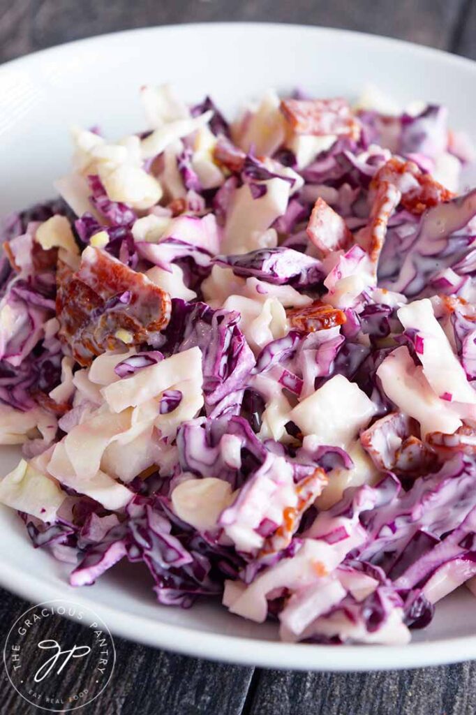 And up close view of this Cabbage Salad recipe. You can see the bacon bits scattered throughout the green and purple cabbage.