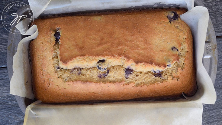 The freshly baked loaf of Lemon Blueberry Bread, just out of the oven.