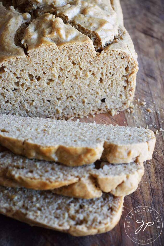 A close up of the loaf of Peanut Butter Bread slices and the loaf sitting behind them.