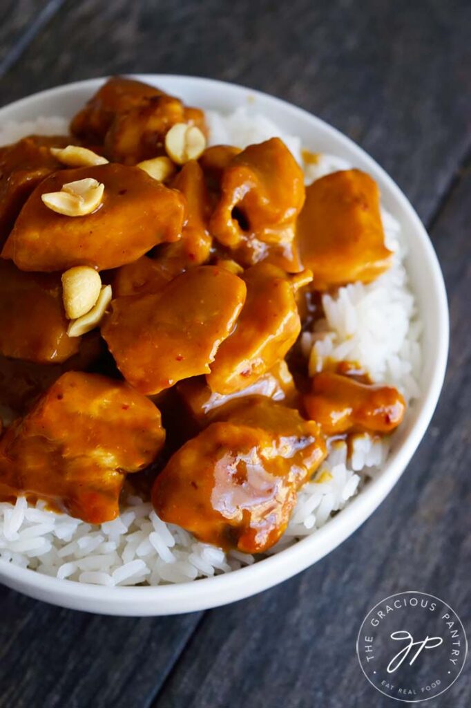 An overhead view of this Peanut Butter Chicken, garnished with peanuts.