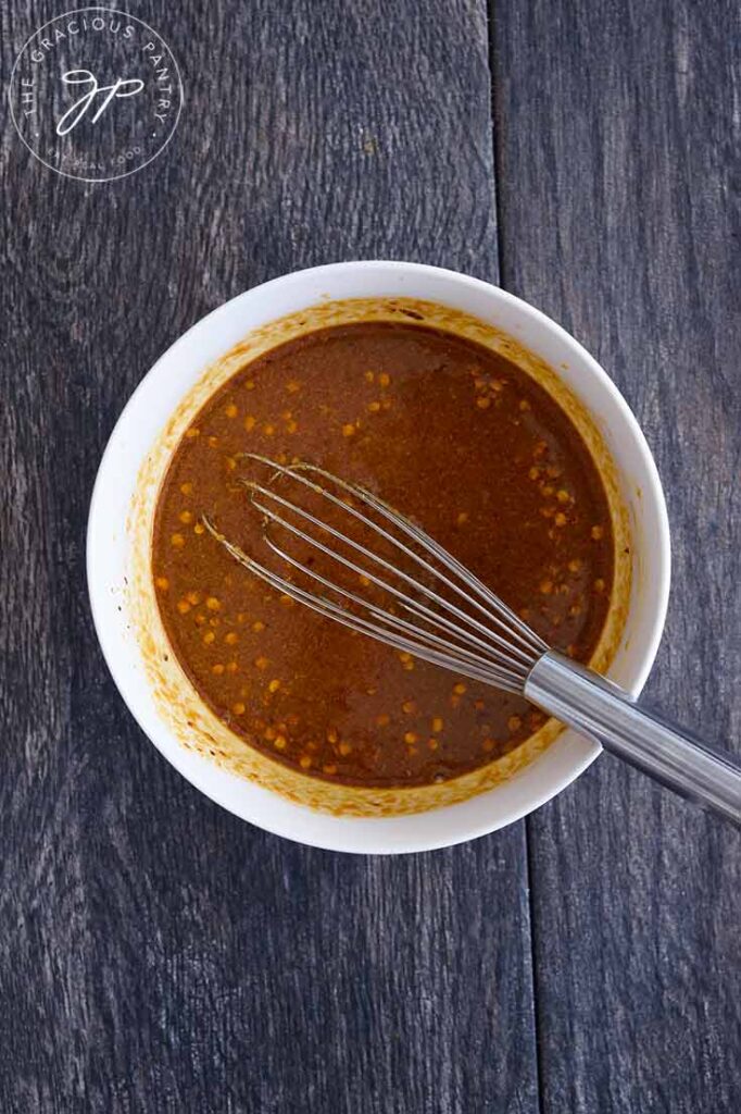 Peanut butter sauce, just mixed in a white mixing bowl.