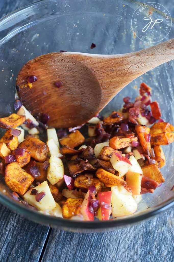 The Roasted Potato Salad in the mixing bowl, ready to be spooned over a bed of cabbage.