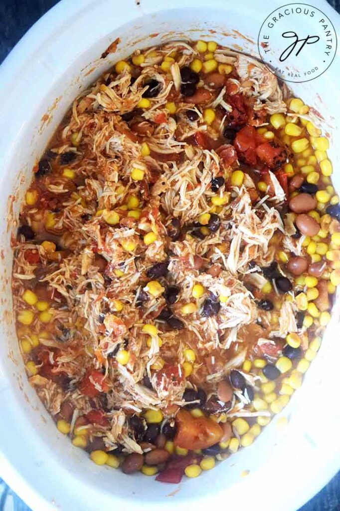 Slow Cooker Southwestern Chicken, just shredded and still sitting in the slow cooker.