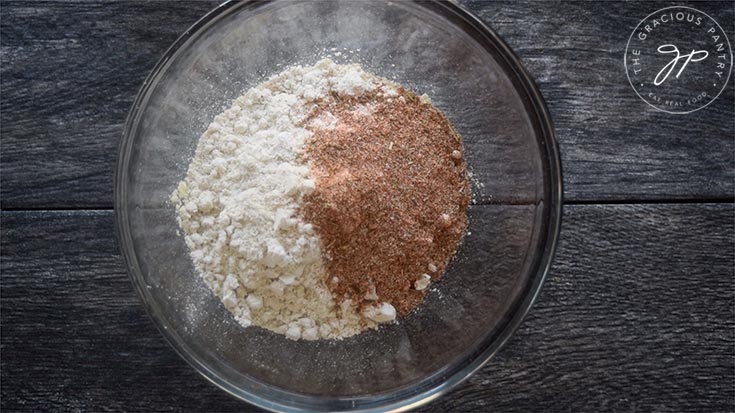 The breading mix ingredients in a mixing bowl, waiting to be whisked together.