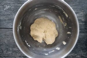 The finished dumpling dough, resting in its mixing bowl.