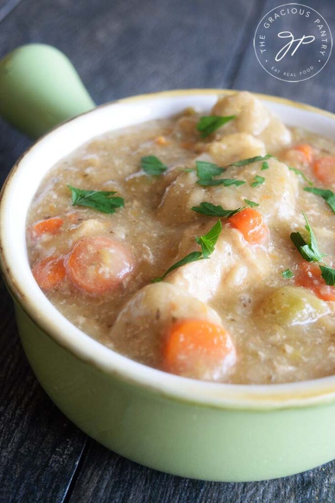 A green crock filled with this Healthy Chicken And Dumplings Recipe