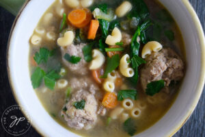 The finished Healthy Italian Wedding Soup Recipe in a white bowl.