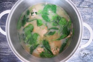 The spinach and fresh parsley wilted into the hot broth of this Healthy Italian Wedding Soup Recipe.