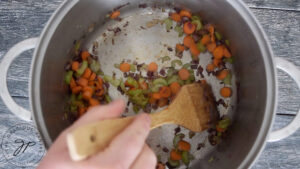 The browned onions in the pot.