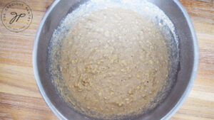 The batter ingredients mixed together in a metal mixing bowl.