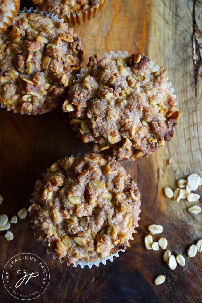 And overhead shot looking down at three Oat Flour Muffins With Streusel Topping.