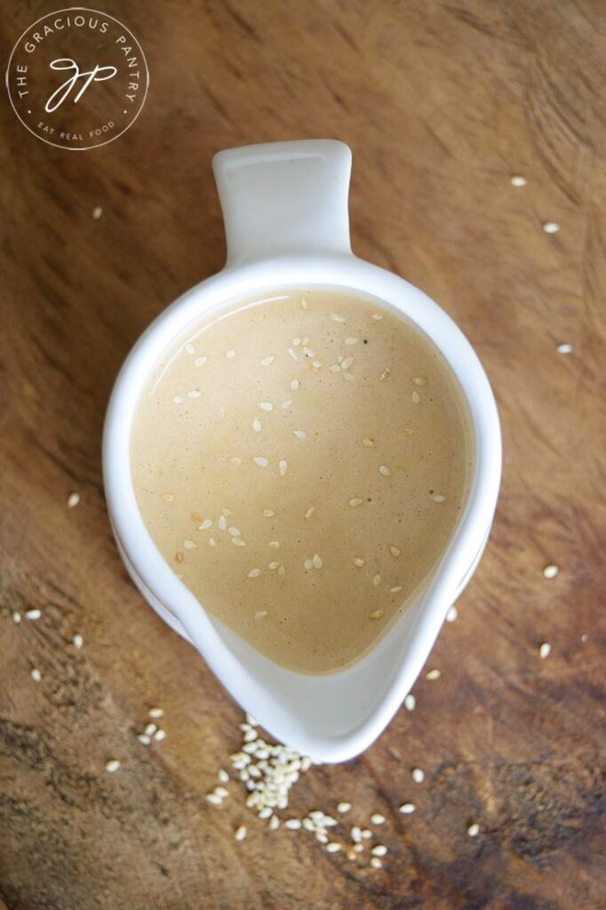 And overhead view of a white pitcher filled with Sesame Vinaigrette.