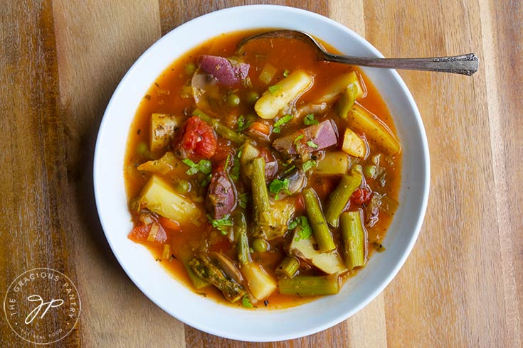 The finished Spring Minestrone Soup Recipe served in a white bowl.