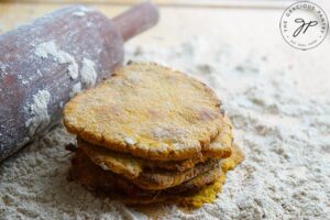 A side view of the finished Sweet Potato Flatbread stacked on a cutting board.