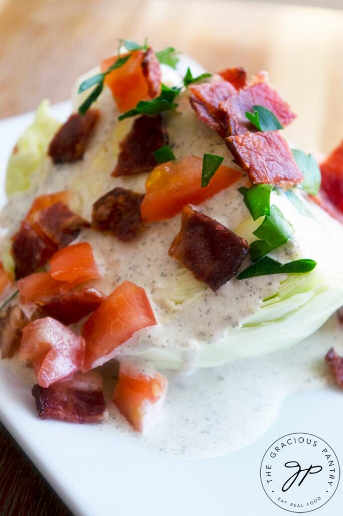 A close up shot of a traditional version of this salad on a white plate.