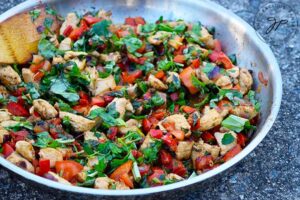 The finished Bell Pepper Chicken Recipe in a stainless steel skillet.