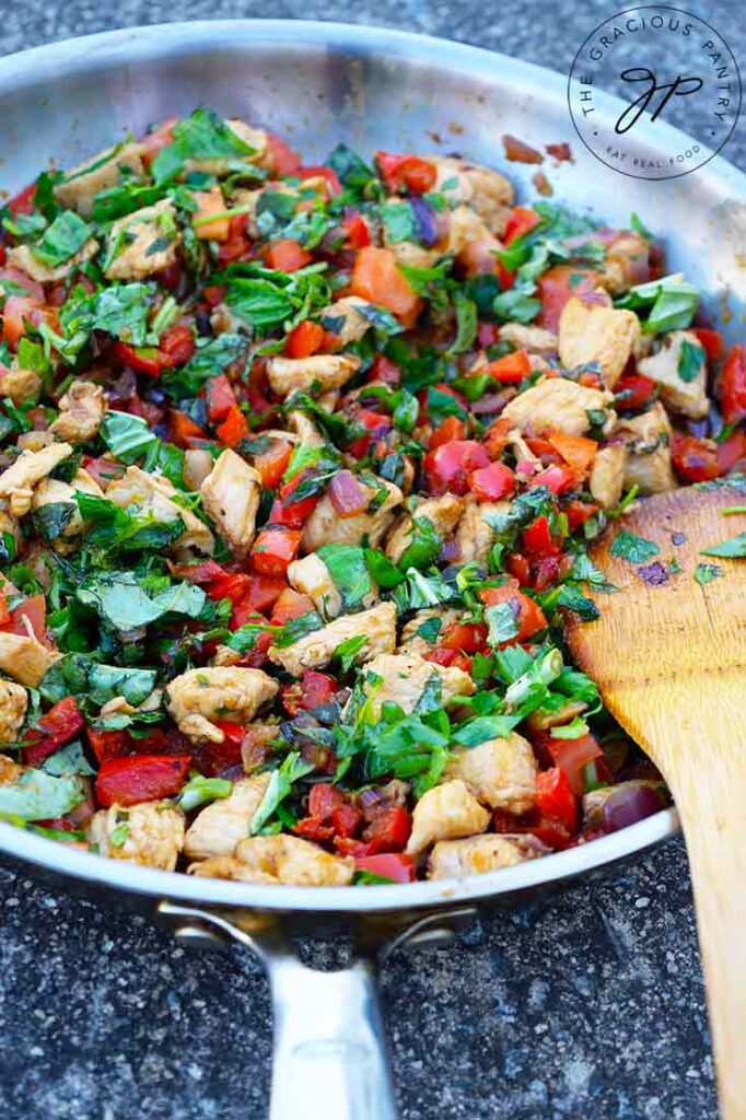 A sliver skillet filled with this Bell Pepper Chicken Recipe.