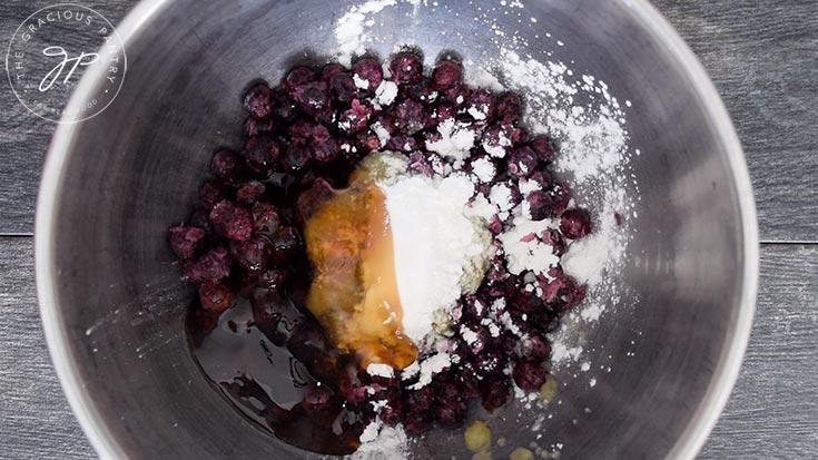 The Blueberry Pie filling ingredients added to the mixing bowl for this Blueberry Pie Recipe.