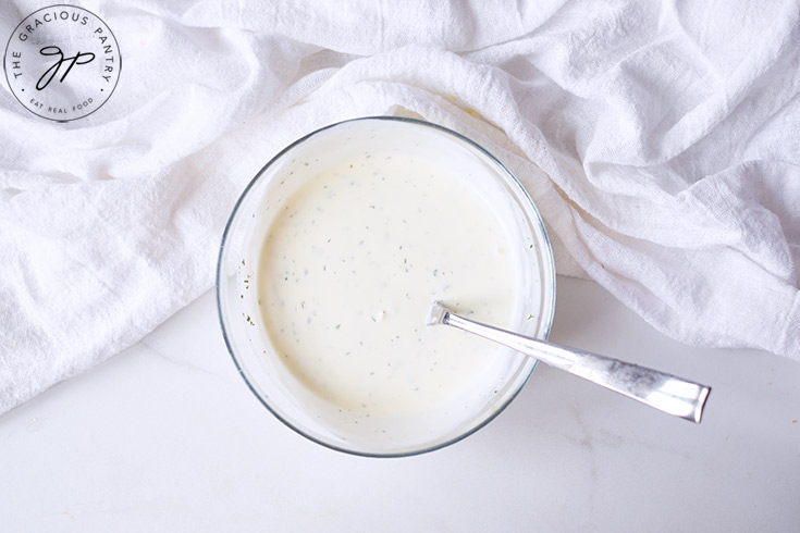 The Buttermilk Ranch Dressing Recipe ingredients mixed together in a small mixing bowl