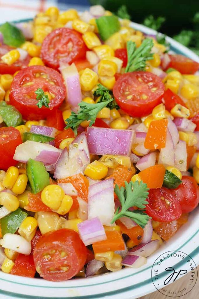 An up close view of a bowl of this Cajun Corn Salad Recipe.