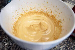 The fluffy, whipped coffee in the mixing bowl.