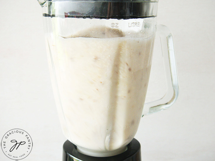 Blending the rice and water in a blender until smooth.