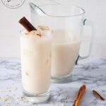The finished Homemade Horchata in a pitcher, and served in a glass.