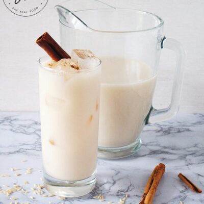 The finished Homemade Horchata in a pitcher, and served in a glass.