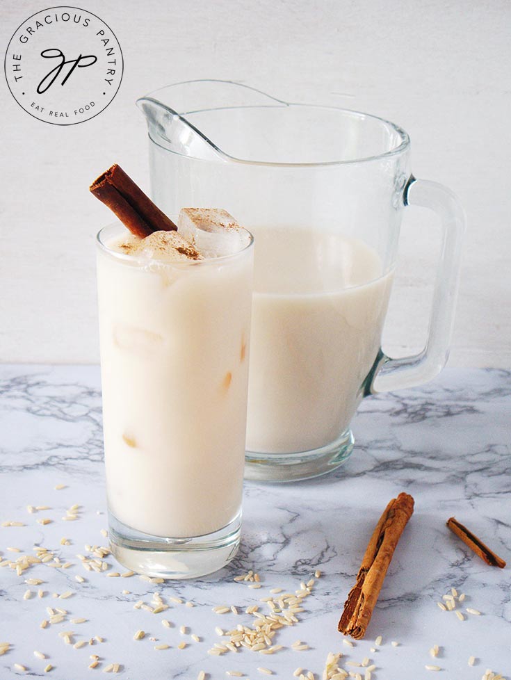 The finished Homemade Horchata in a pitcher, and served in a glass.