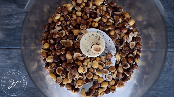 The roasted hazelnuts in the food processor for this Homemade Nutella Recipe.