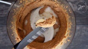 Scooping out a spoonful of the hazelnut butter.