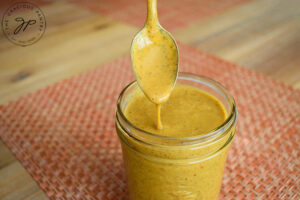 The finished Carolina Mustard Barbecue Sauce Recipe in a canning jar.