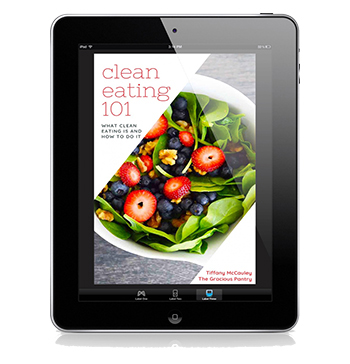 The cover of this Clean Eating 101 eBook displayed on a black iPad.
