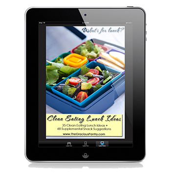 The cover image of this Clean Eating Lunch Ideas ebook displayed on a black iPad.