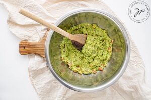 The guacamole all mixed together in a mixing bowl.