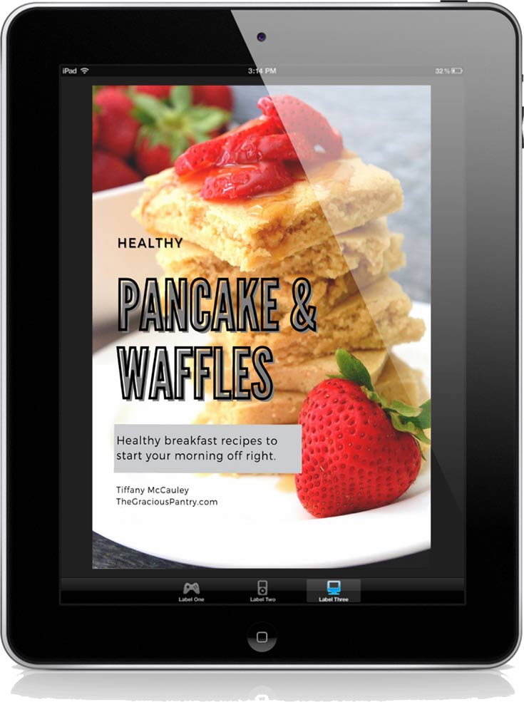 The cover of this Healthy Waffle & Pancake Recipes eCookbook displayed on a black iPad.