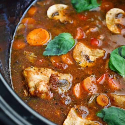 An up close view of Slow Cooker Chicken Cacciatore still on the crock.