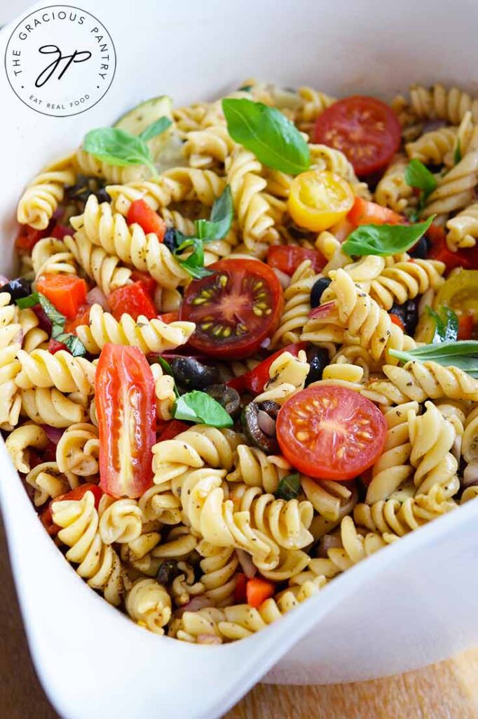 A white serving bowl filled with this Vegetable Pasta Salad Recipe.