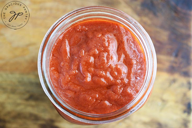 The finished Maple BBQ Sauce in an open canning jar.