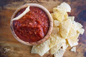 The finished restaurant salsa in a bowl with corn chips on the side.