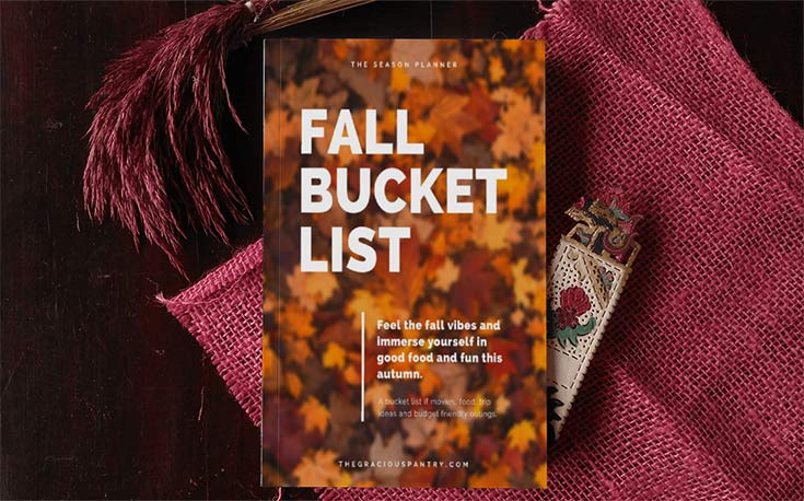 Fall Bucket List Cover displayed as a book, laying on some fall colored blankets (this is not a physical book. It's a digital download)