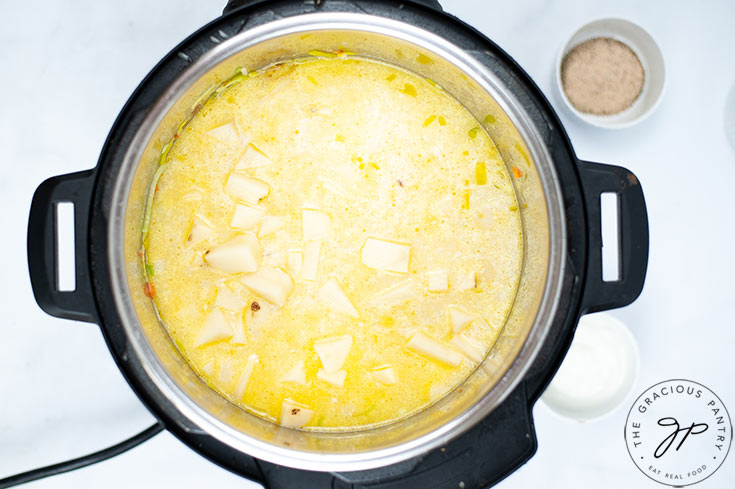 The cooked soup sitting inside the Instant Pot.