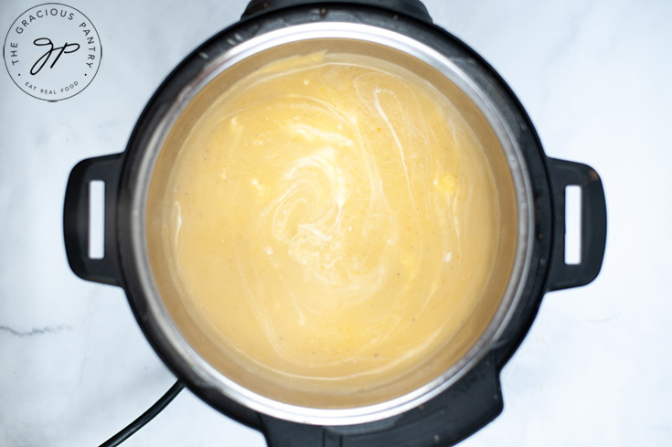 The smooth, blended soup sitting inside the instant pot.