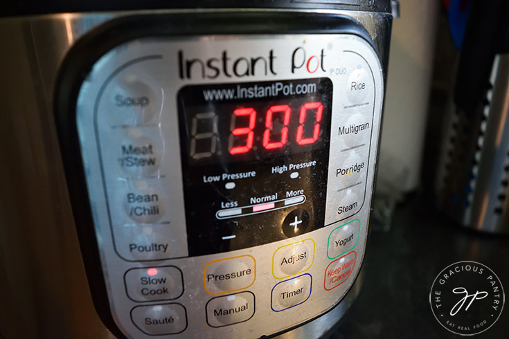 The timer on the Instant Pot adjusted to 3 hours for apple butter reduction.