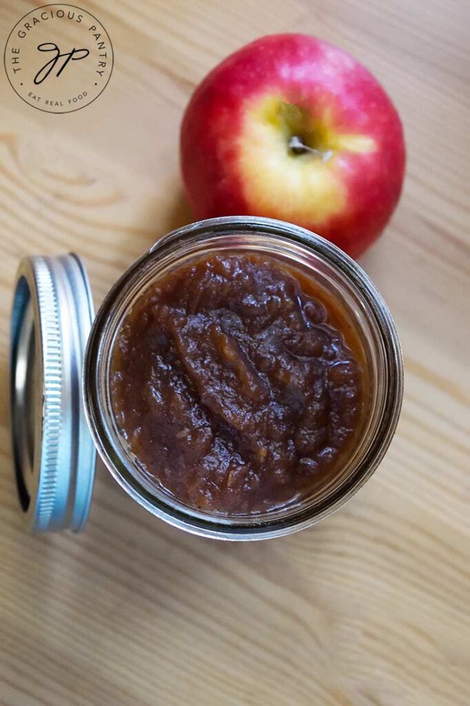 An overhead shot looking down into a canning jar filled with Amish Apple Butter.